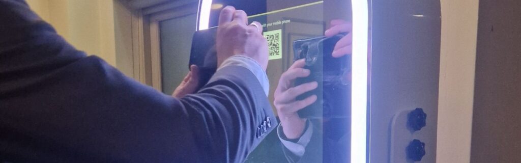 qr code being scanned on an open photo booth