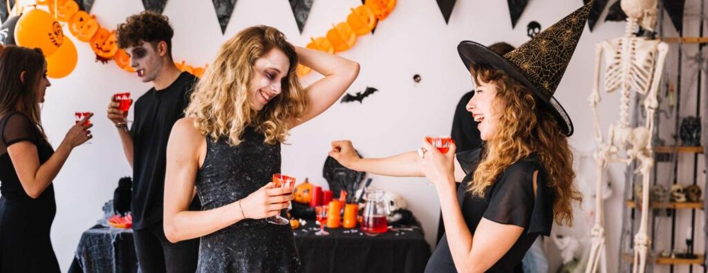 people in halloween outfits at a party