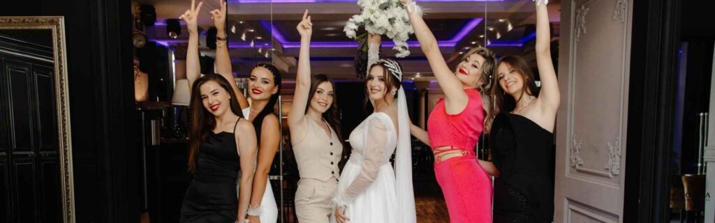 bride with her friends dancing