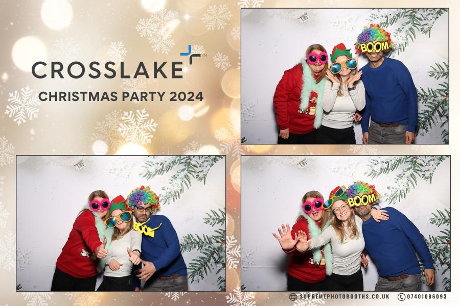 group of people in props taking pictures on a photo booth at a corporate party in manchester
