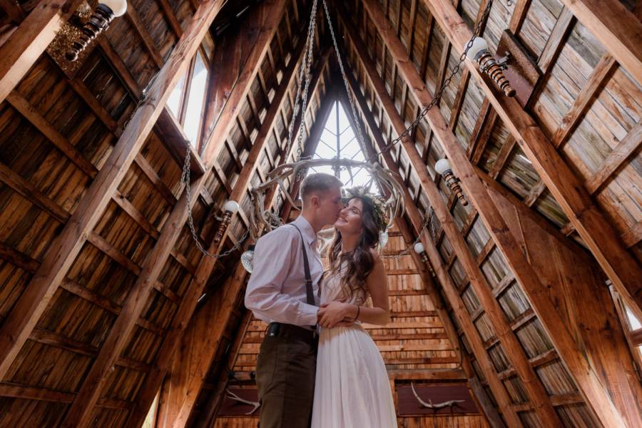 manchester barn wedding venue with a couple kissing