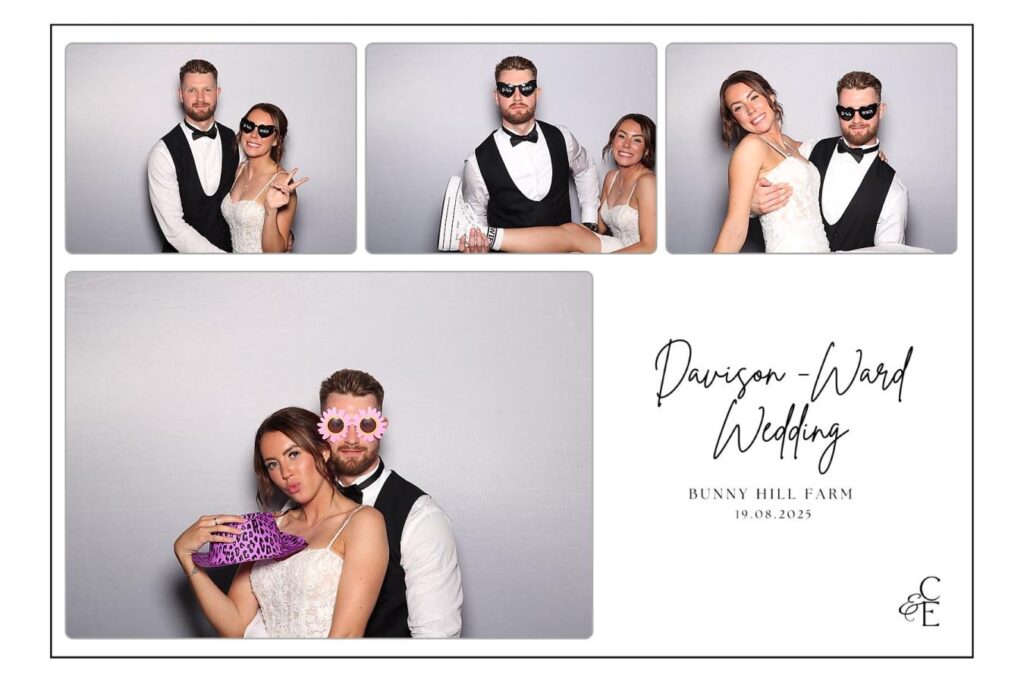 bride and groom taking a photo booth picture