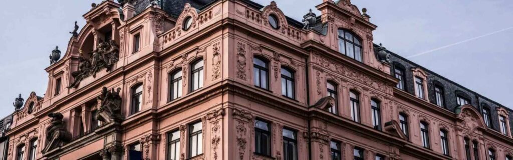upward view of burgundy grade ii-listed building in york