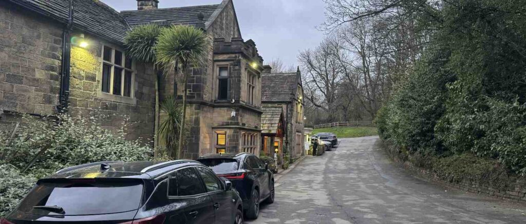 entrance with cars to whitley hall hotel