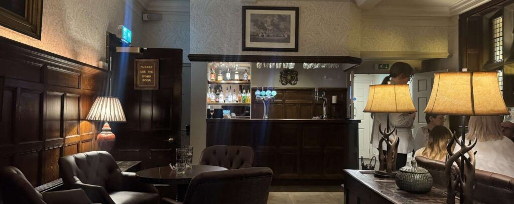 bar area with leather chairs and hotel guests