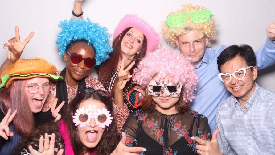 wedding guests taking pictures with wihs and furry glasses